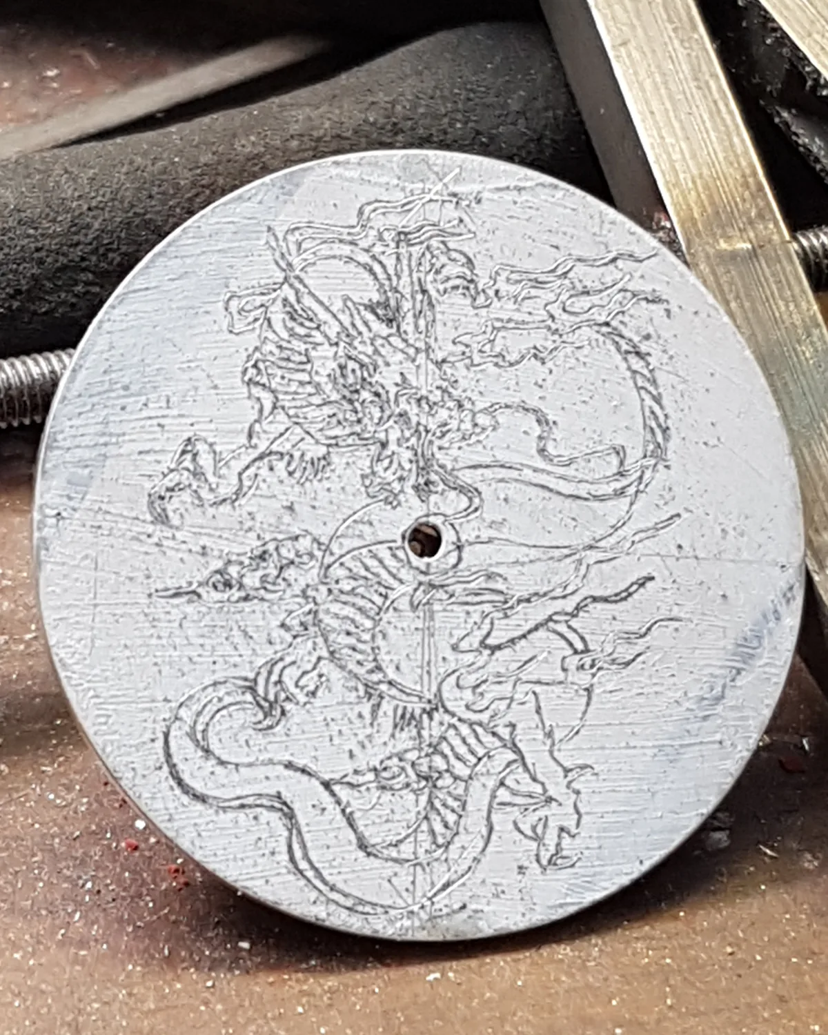 The dial design transferred in graphite onto white paint