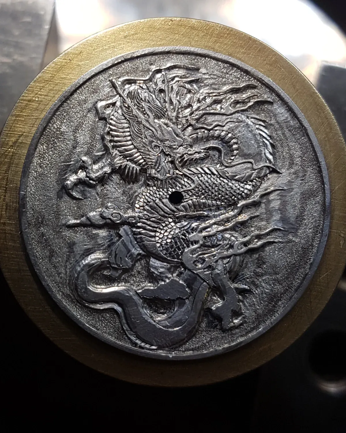 Finer engraved detail being cut into the dial